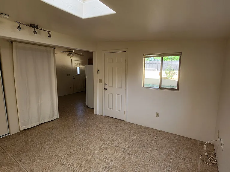 Bedroom with Private, Covered Patio and Fenced Yard