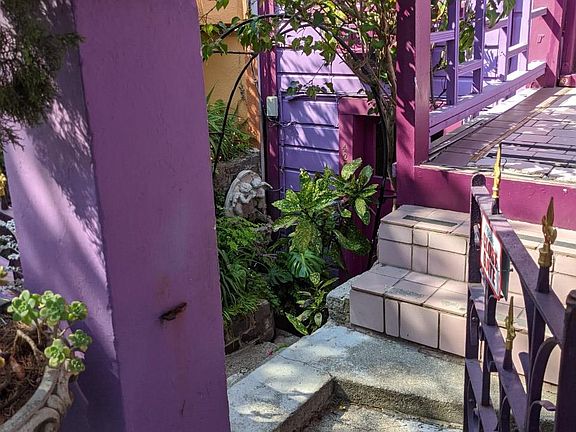 Gated entrances to property down five steps