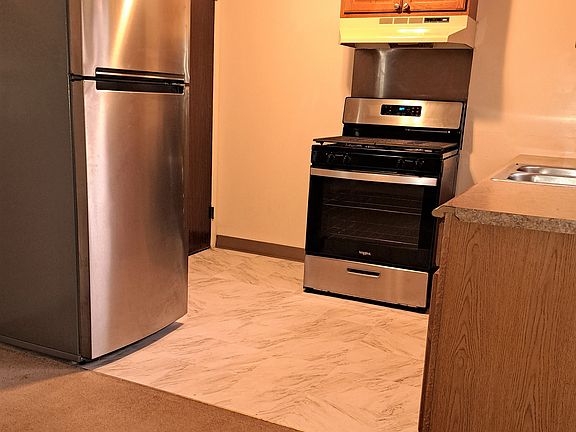 New stainless steel refrigerator in kitchen