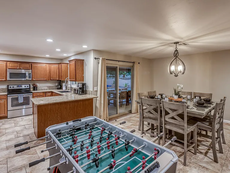 Modern kitchen featuring stainless steel appliances and abundant cabinet storage.