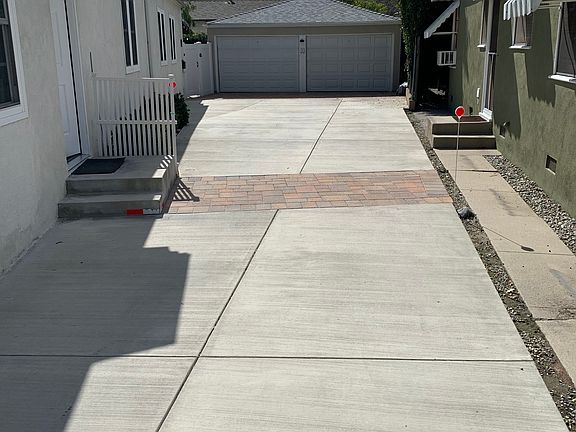 apt-A entry steps. Apt-A parking for 2 cars one in garage on right side- 
 one tandem parked directly behind