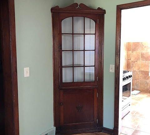 Corner hutch in dining room/living room.