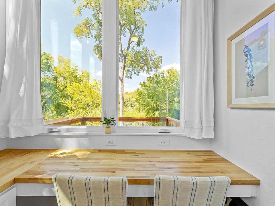 Huge casement windows opening out to the private deck; perfect for date night or a day-time workspace