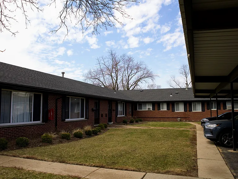 outdoor shot of apartments; carport to the right