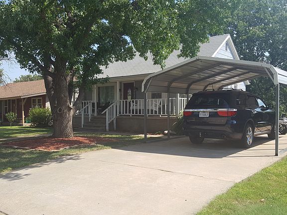 Front driveway with carport.