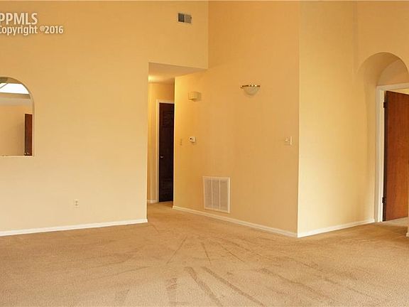 View from the Living Room to the Master Suite on the right and the hallway to th