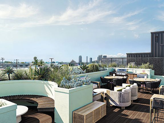 Find your community at Bloom's rooftop retreat, the perfect spot to connect, relax, and savor stunning views.