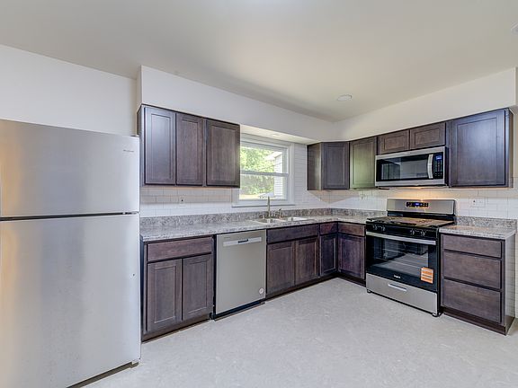 There is a door to the side patio and BBQ area.