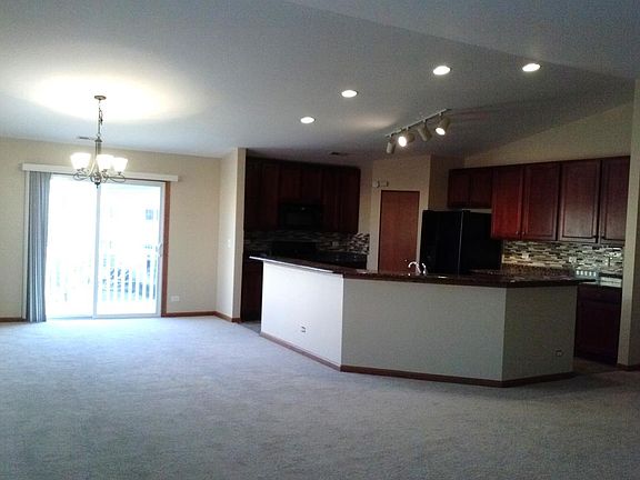 huge kitchen with 42-inch cherry cabinets, granite counterto