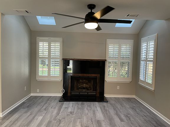 Family Room with skylights and a view of the pond out back