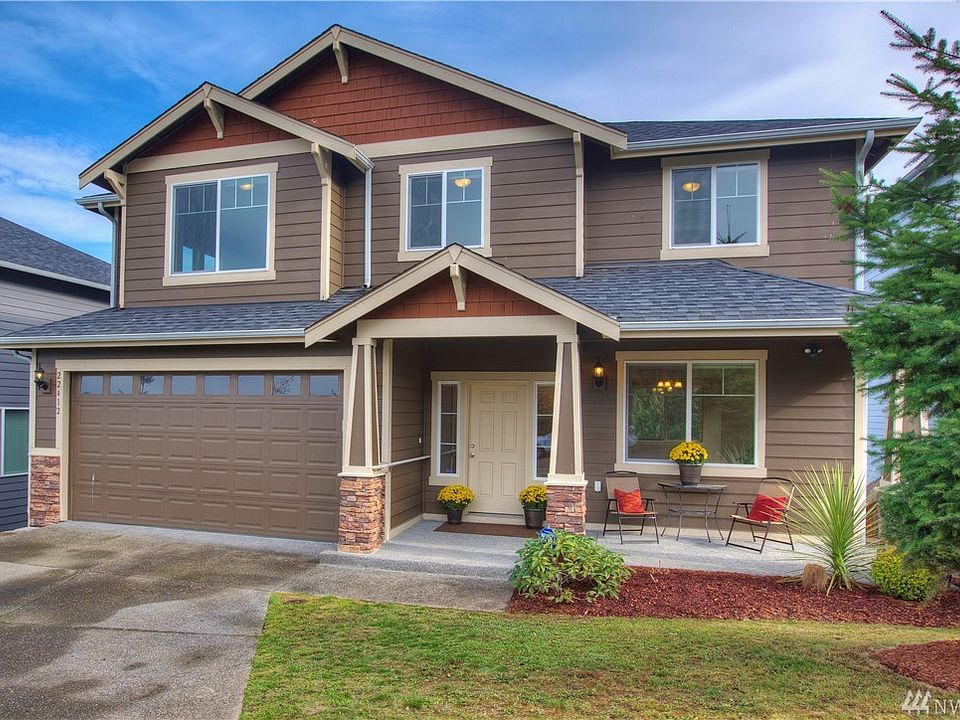 Elegance and Charm, this Photo is Featuring an Enchanting Covered Patio! Built in 2013 this home is almost new! You have to see this in person. Especially the view from the back! 