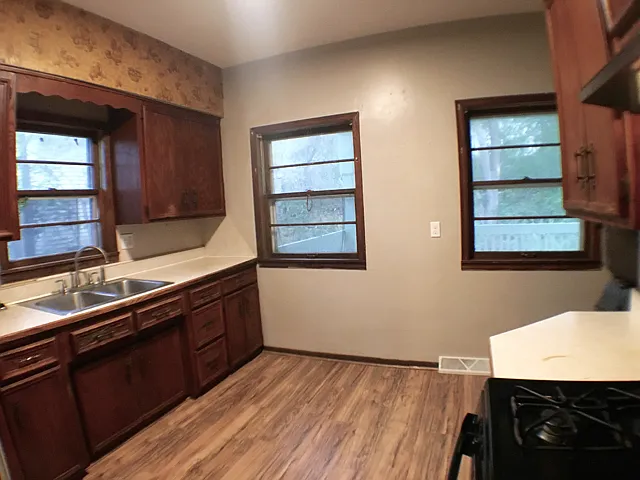 The large kitchen looks out over the back deck.