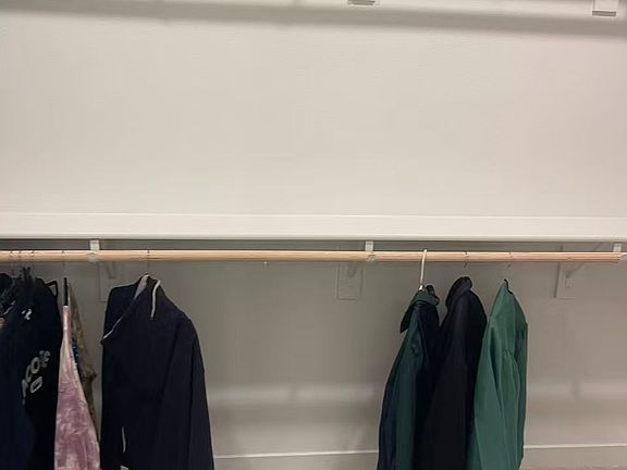 Closet of one of the bedrooms.