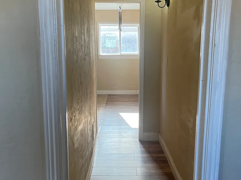 hall between bedroom and living room/ kitchen