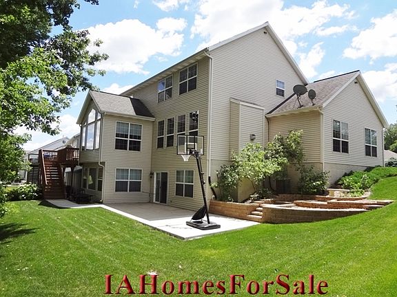 Walk-out basement onto extended patio with custom landscaping.