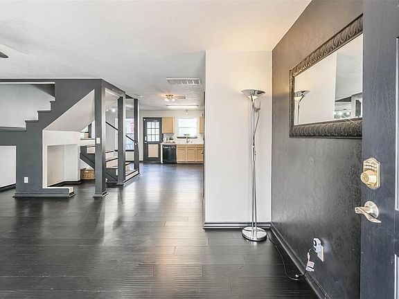 Talk about open concept! The current sellers opened the stairway to add extra storage, a desk area and a great little opening under the stairs perfect for a kids playhouse or dog retreat.