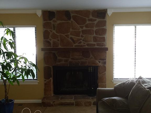 Stone Fireplace / Large Windows