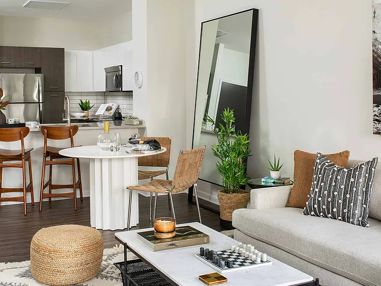Apartment Living Room, dining area and kitchen with wood floors.