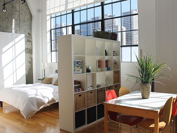 Bedroom with large factory windows