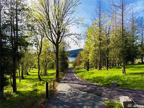 Private drive with gated entrance to the property - looking south towards Campbell Lake from the entrance to the property