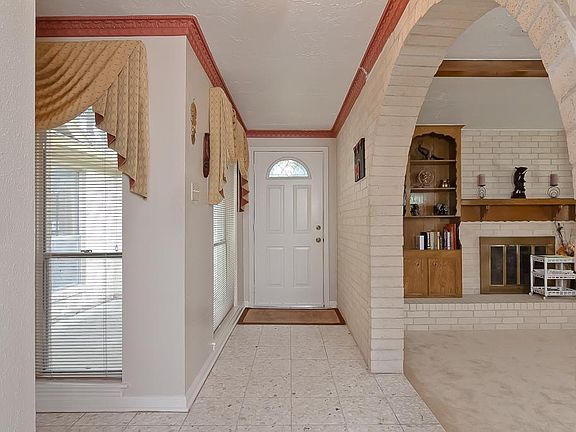 Spacious entryway with Living room and Formal Dining on right and left.