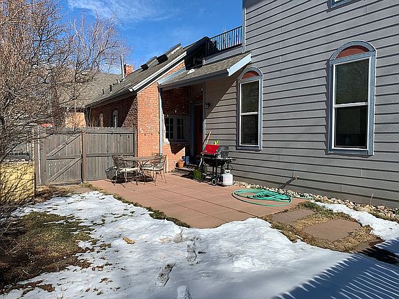 Back door with fenced patio
