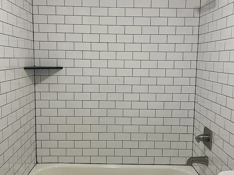 Beautifully renovated hall bathroom, featuring all-new amenities for a modern and refreshing space.