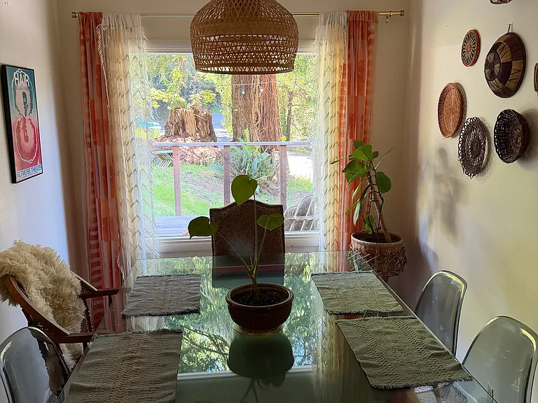 Dining table with view of deck and front yard