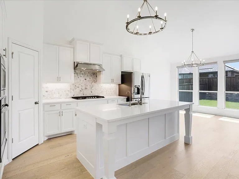 Elegant kitchen with stainless-steel appliances.appliances.