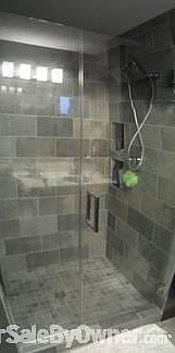 Master Bath
						:
						All Tile, frameless glass door, built in storage