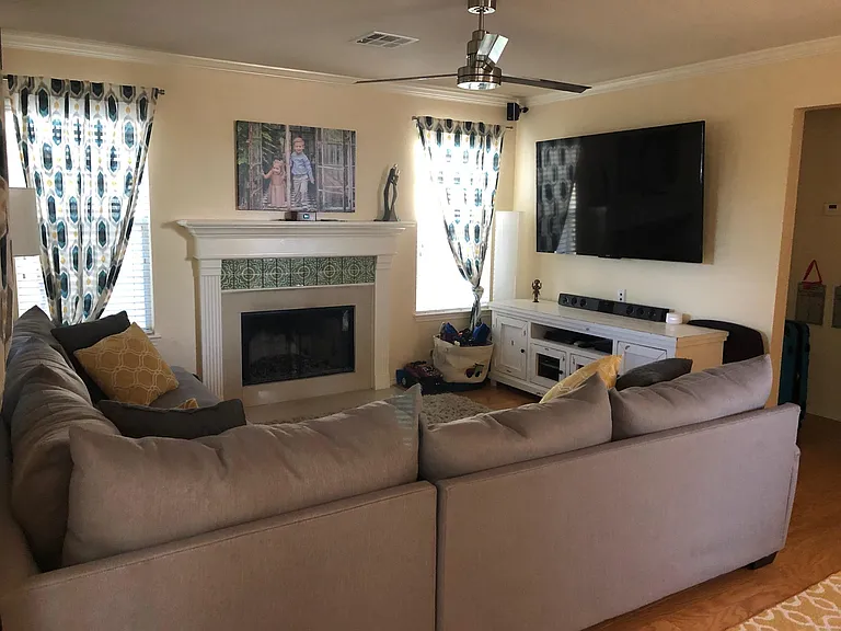 Fireplace has option for both gas and fire burning. Screened in patio is right off the living room giving you an extra living area to relax in.