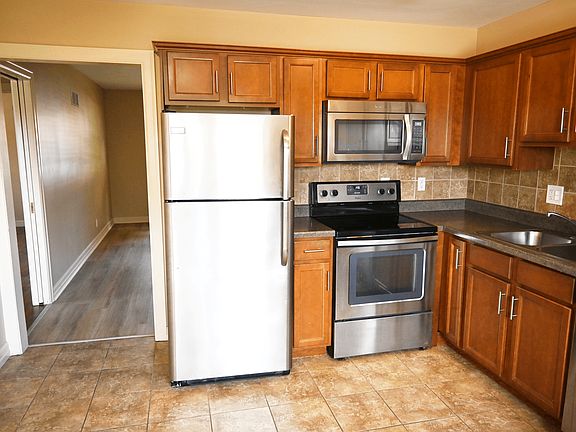 Kitchen with stainless steel appliances at Square 131 5-Plex.