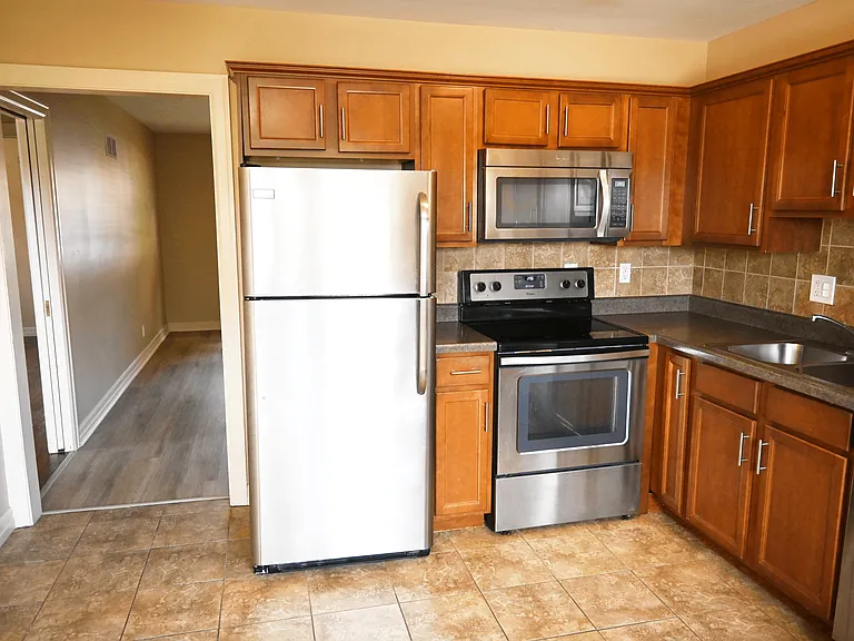 Kitchen with stainless steel appliances at Square 131 5-Plex.