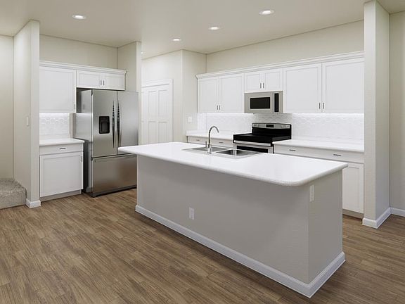 Fall in love with your new kitchen with a counter-height island and a large pantry. Artists render