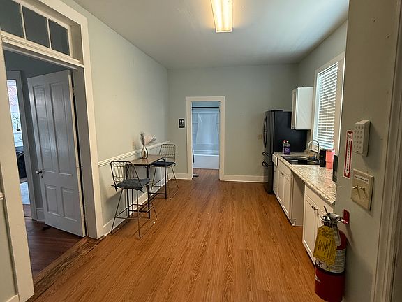 Kitchenette area includes small table; stove and dishwasher coming soon