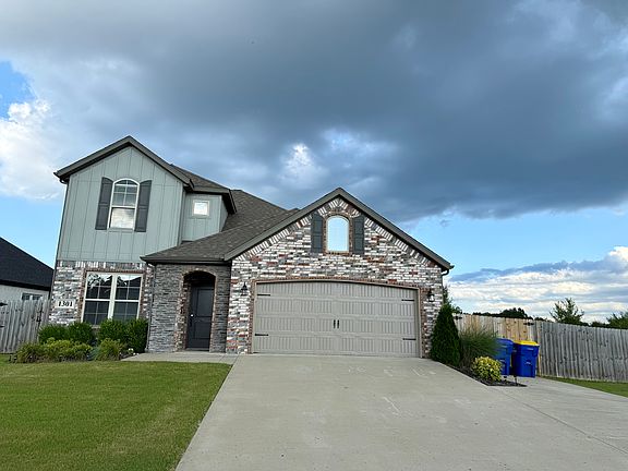 Front view of the home with additional parking space