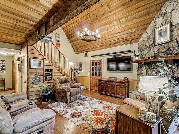 Image 5: Exposed Beams & Cedar Plank Ceiling