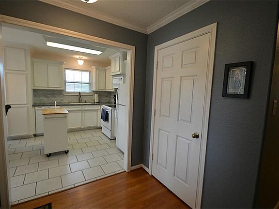 ALTERNATE VIEW OF ENTRY AREA WITH LARGE COAT CLOSET.
