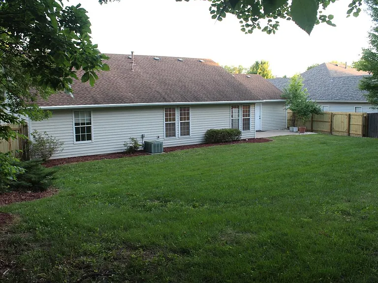 The large backyard is fully fenced with 6 foot tall wood fen