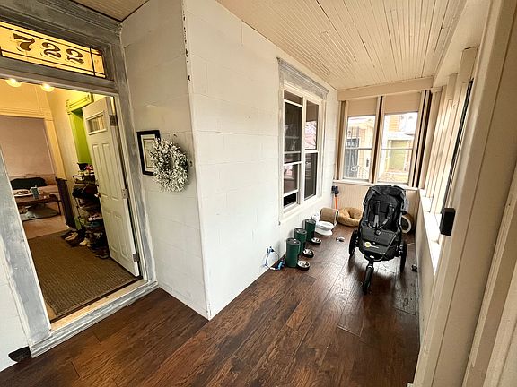 Enclosed common area porch.