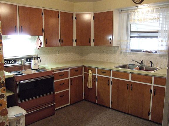 Kitche includes range, refrigerator, microwave