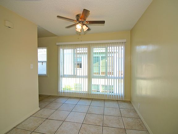 Dining room - large, bright windows & ceiling fan