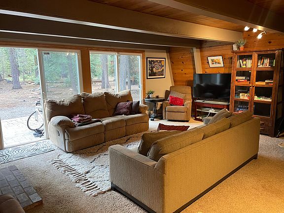 Living area features a large Samsung television and plenty of games/books for those long winter nights.
