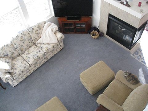 Living room or family room w2 story height windows