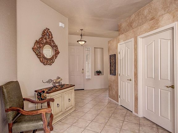 entryway facing front door, pantry doors