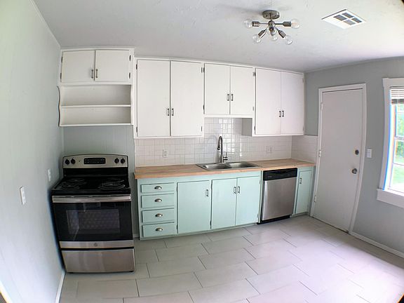 Updated tile and painted cabinets. Butcher block counters