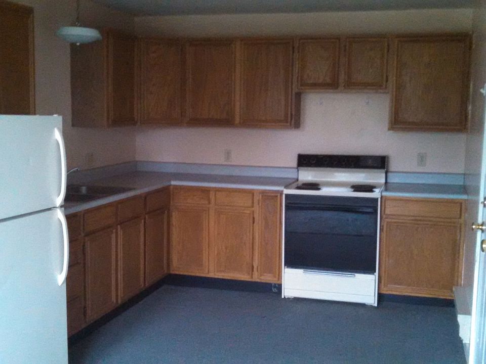 Kitchen comes with an electric range/oven and refrigerator.