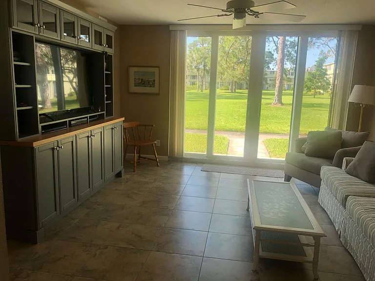 Gathering Room view with Custom Entertainment Center. Courtyard view; no direct sun.