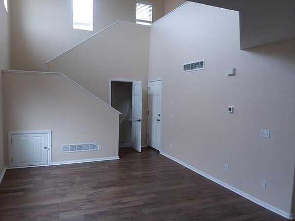 Living Area (Open Door to Downstairs Bath/Closed Door to Garage)