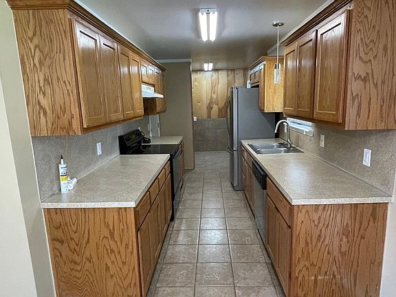 Kitchen/Utility off dining area fridge, stove, dishwasher